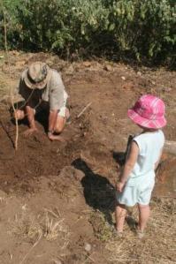 dad and Jade plant a tree