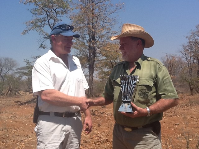 Mark Saunders of Malilangwe meets Clive under a Mopani Tree