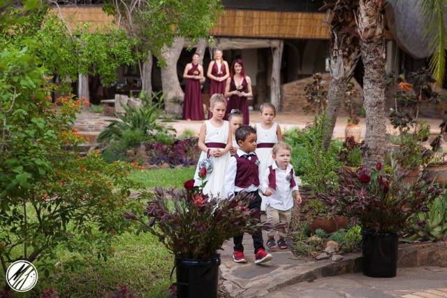 the bridal girls walk thru the gardens