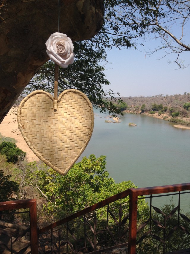 heart fans hanging from the wedding deck at Chilo